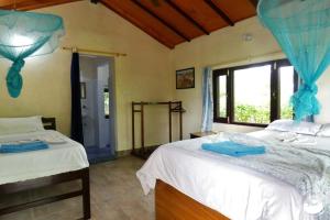 Postel nebo postele na pokoji v ubytování Bardia Homestay Pvt. Ltd.