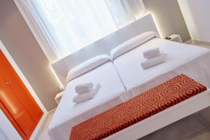 Postel nebo postele na pokoji v ubytování Hotel DL Port