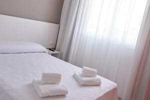 Postel nebo postele na pokoji v ubytování Hotel DL Port