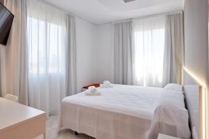 Postel nebo postele na pokoji v ubytování Hotel DL Port