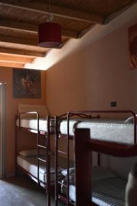 A bed or beds in a room at Ostello Salento