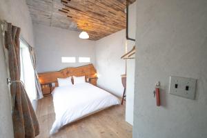 Letto o letti in una camera di Ichi The Hostel