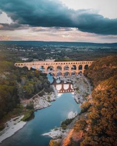 an aerial view of a bridge over a river at Maison de ville à proximité du centre historique in Villeneuve-lès-Avignon