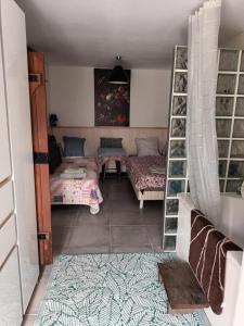 Postel nebo postele na pokoji v ubytování Le refuge