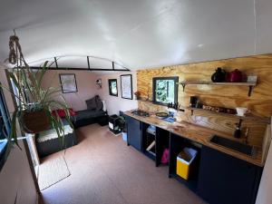 an aerial view of a kitchen in a tiny house at Hop and hare farm in Hastings