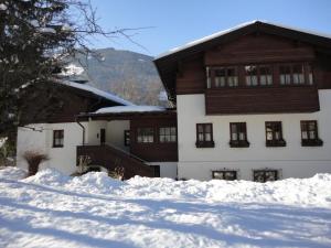 a house with snow in front of it at Alte Schmiede in Bad Gastein