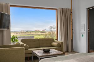 Posezení v ubytování Eyvindarholt Guesthouse