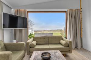 Posezení v ubytování Eyvindarholt Guesthouse