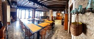 a dining room with a long table and chairs at CASA RUINA in Nava del Rey