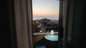 a room with a window with a table and a view at Bellavista Punta Ala in Punta Ala +40 photos