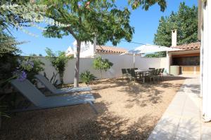 Zahrada ubytování Adorable maison de vacances plain pied au coeur de la station et proche des plages 4 chambres, jardin, WIFI, LXDUNE1