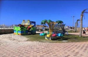 a park with a playground with a play equipment at شاليه ديمورا عائلات فقط Dimora Chalet Only Family in Dawwār Muḩammad Abū Shunaynah
