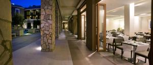 a restaurant with tables and chairs in a building at Hotel Playa Calera in Valle Gran Rey