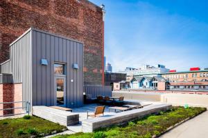a house on the roof of a building at Bright Fort Point Studio w WD in Unit BOS-260 in Boston