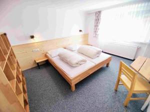 Ein Bett oder Betten in einem Zimmer der Unterkunft Gruppotel Alte Post