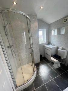 a bathroom with a shower and a toilet at Pasture Place in Goole