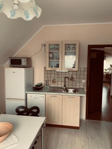 Kuchyň nebo kuchyňský kout v ubytování Ferienwohnung Poczewski