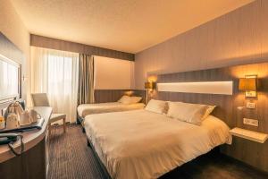 Postel nebo postele na pokoji v ubytování Best Western Marseille Aeroport