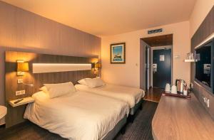 Postel nebo postele na pokoji v ubytování Best Western Marseille Aeroport