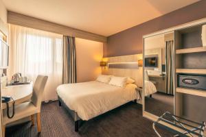 Postel nebo postele na pokoji v ubytování Best Western Marseille Aeroport