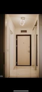 a large door in a room with a hallway at Luxury Apartment in Lukavac