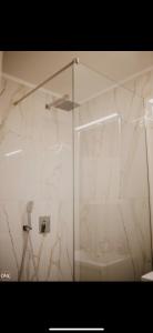 a shower with a glass door in a bathroom at Luxury Apartment in Lukavac