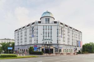 a large white building with a dome on top of it at Radisson Blu Sobieski in Warsaw
