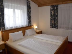 A bed or beds in a room at Apartment Ferienglück by Interhome