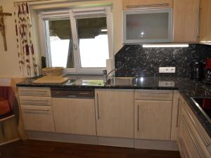 A kitchen or kitchenette at Apartment Ferienglück by Interhome