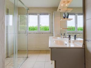 een badkamer met een wastafel en een douche bij Holiday Home Le Saint Vigor - BAX400 by Interhome in Saint-Vigor-le-Grand