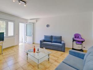 a living room with a couch and a table at Apartment Gavrena by Interhome in Fanadix