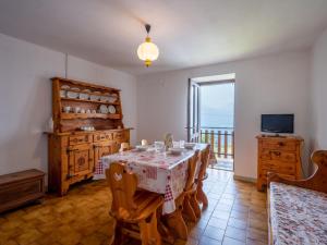 a dining room with a table and a balcony at Apartment Vetan by Interhome in Saint Nicolas