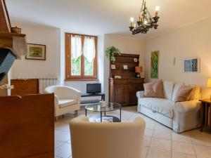 a living room with a couch and a table at Apartment della Nonna by Interhome in Musignano