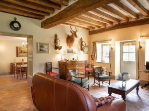 a living room with a couch and chairs at Holiday Home La Maison du Chateau by Interhome in La Tagnière