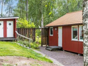 a couple of red and white homes in the woods at Holiday Home Gapern - VMD044 by Interhome in Killstad