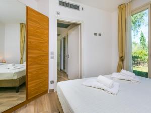 Posteľ alebo postele v izbe v ubytovaní Holiday Home Biovillage-6 by Interhome