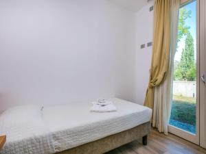 Posteľ alebo postele v izbe v ubytovaní Holiday Home Biovillage-6 by Interhome