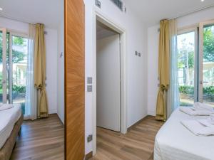 Posteľ alebo postele v izbe v ubytovaní Holiday Home Biovillage-6 by Interhome