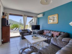 a living room with a couch and a table at Apartment La Madrague d'Azur-7 by Interhome in La Madrague