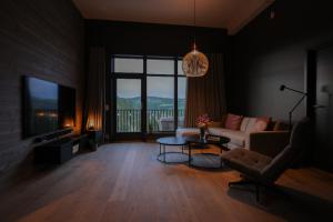 a living room with a couch and a table at Elegant apartment in Trysil Alpine Lodge in Trysil