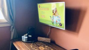 a flat screen tv hanging on a wall at CHALET in Milan