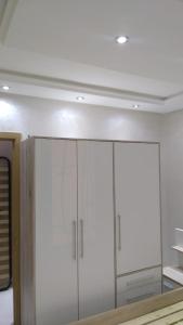 a room with white cabinets and a white ceiling at Complexe zohour in Tangier