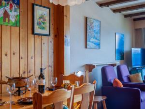 a dining room with a table and chairs at Studio Christiania I R3 by Interhome in Nendaz