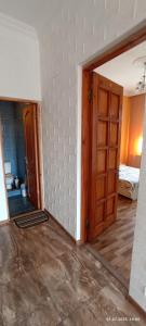 En eller flere senge i et værelse på Olesya Guesthouse