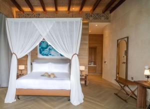 Postel nebo postele na pokoji v ubytování Mango House Seychelles, LXR Hotels & Resorts
