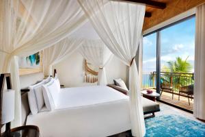 Postel nebo postele na pokoji v ubytování Mango House Seychelles, LXR Hotels & Resorts