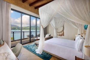 Postel nebo postele na pokoji v ubytování Mango House Seychelles, LXR Hotels & Resorts