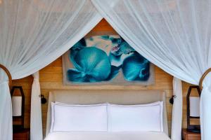 Postel nebo postele na pokoji v ubytování Mango House Seychelles, LXR Hotels & Resorts
