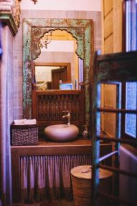 a bathroom with a sink and a mirror at Dworek San Maryno in Jedlnia-Letnisko +28 photos