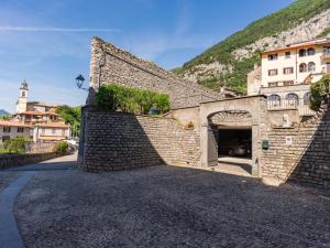a brick building with a garage in a street at Apartment Apartment Vista Brentano by Interhome in Mezzegra